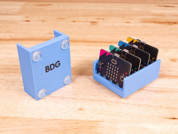 We like to stick a few rubber feet to the bottom of the tray to prevent sliding around or scratching your desk.