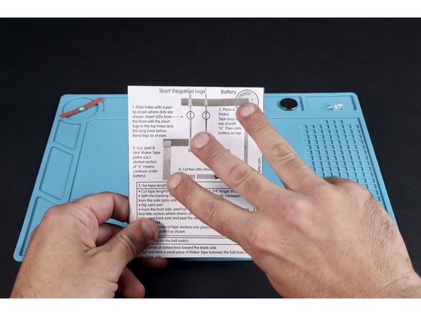 Stick those three tape sections into place where shown for pathways a,b,c. Tape paths &quot;a&quot; and &quot;b&quot;  go OVER the LED legs.