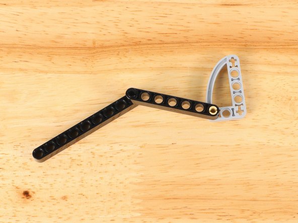 Slide the end of the gate arm onto the shaft of the servo.