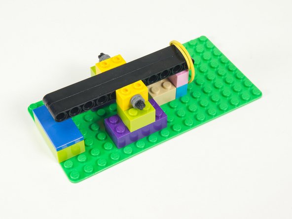 You’ll also need some bushings to hold the axle in place. You can use the LEGO Half Bushing (32123 / 42136) or LEGO Technic Bush 1/2 with Teeth Type 1 (4265) or LEGO Technic Bush 1/2 with Teeth Type 2 (4265).