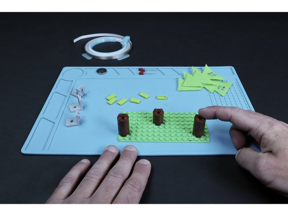 Use the Physical Build Guide found in the docs section to assemble the three tree trunks/baseplate portion of the project.