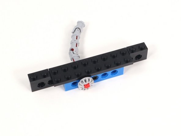 Add 1x2 plates to each end of the 1x12 brick with holes.