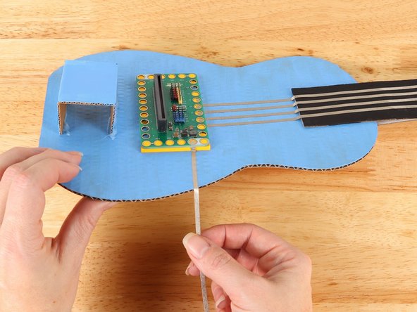 Place the Bit Board on top of the tape path to secure it in place.