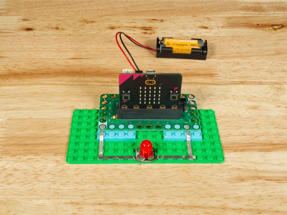 Connect the Negative (-) side of the LED to a Ground (GND) hole on the Bit Board.