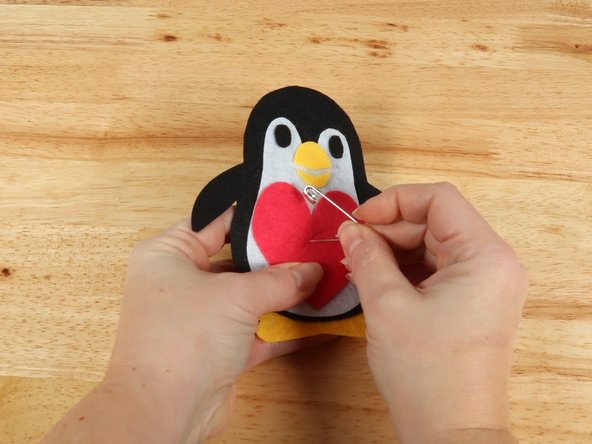Use a safety pin or a push pin to poke two holes through the felt for the LED legs to go through.