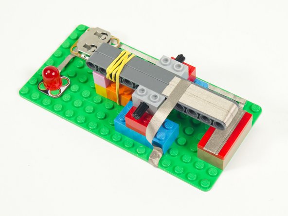 In Step 18 we added Maker Tape that connected to the Contact Brick, so now we need to add Maker Tape that will connect to the lever side of the switch.