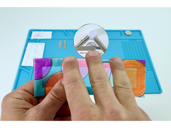 Peel and stick the paths shown in photo 1. This should leave you with two sections of Maker Tape.