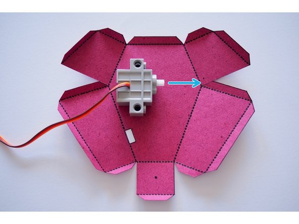 Position the servo on the body.