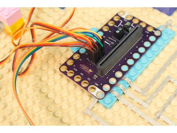 The servos have all three wires together in a connector that plugs right into the pin headers on the Bit Board. Just make sure you plug it in the right way or your servo won't work!
