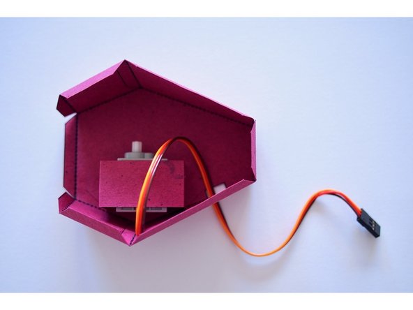 Fold and glue the back tab of the body.