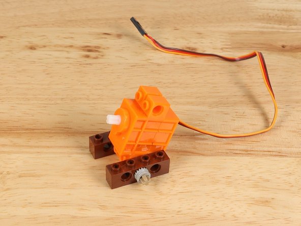 LEGO Technic Brick 1 x 4 with Holes (3701)   You'll need two of them.