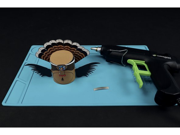 Add the final piece of Maker Tape and fold the lid down to seal the deal! Note: Connecting this final piece of Maker Tape to the top of the battery turns the motor on. Peeling it back will turn it off.