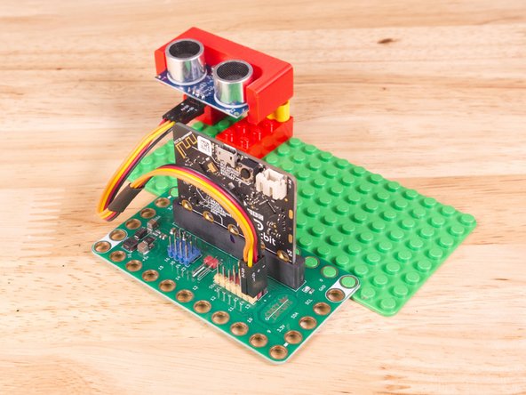 Plug the three-wire connector of the Crazy Circuits Ribbon Cable into the row with Pin 13 on the Bit Board. The wire colors should match the pin header colors, with S1 (yellow) going to the yellow pin.