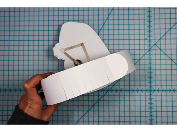 Interlock the slits in two places to create the size that works for your head.