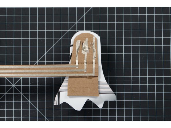 For the shorter (negative) legs we’ll run one piece of 1/8” Maker Tape over them and then run pieces down to the end of the arm.