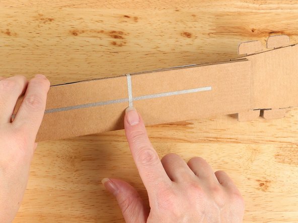 Wrap the tape around to the back of the neck and connect it to the ground pathway.