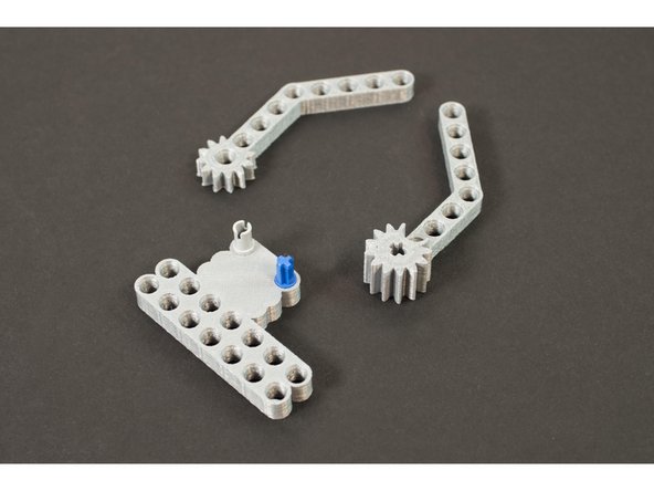 The Gripper fingers are designed with interlocking gears so that when the servo turns one finger, the other finger turns and they meet, closing the fingers together.