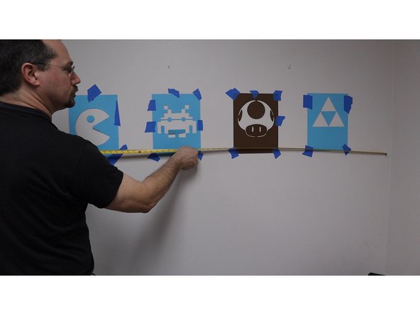 Before painting make sure you measure everything out for spacing and then check to make sure things are level. Nothing is more annoying than one graphic slightly higher than the others, especially when painted on the wall.