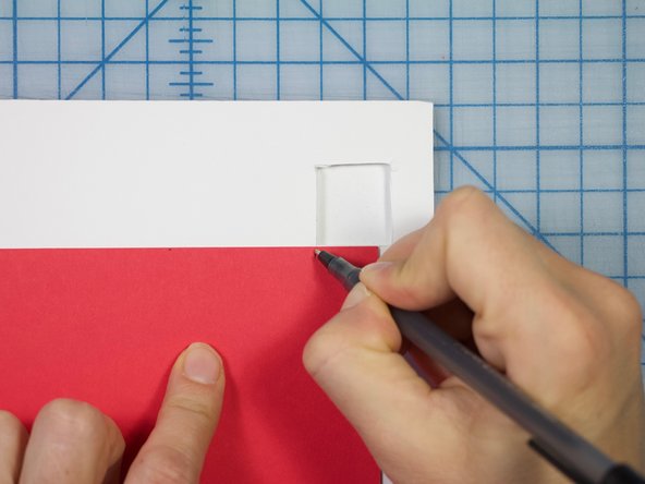 Cut a strip of cardstock that will fit inside the box hole.