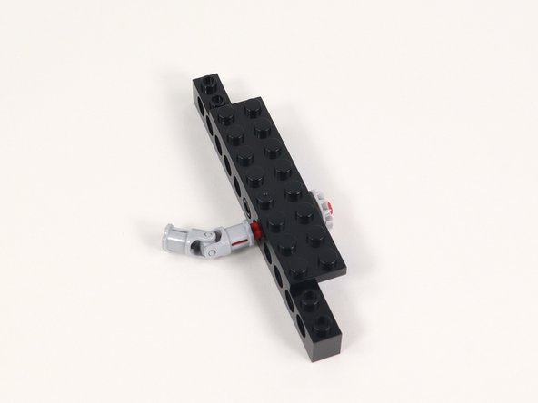 Connect one end of a universal joint onto the end of the axle opposite the gear.