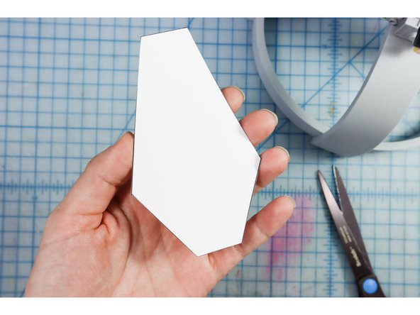 Using the foam template, cut two of the shapes out of foam.