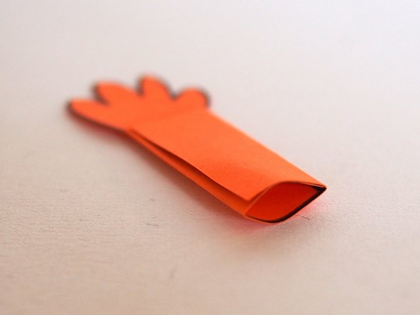 Use a pencil to open up the pocket in the arm. This will make it easier to slide it onto the LEGO axle mount.