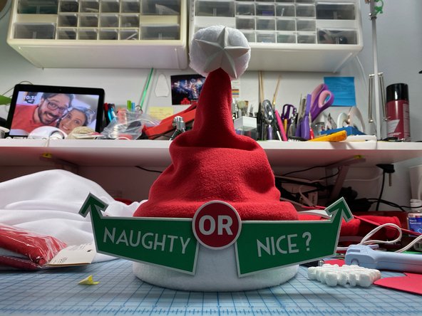 Download and cut out the &quot;Naughty or Nice?&quot; template out of paper, craft foam, or any material that you like.