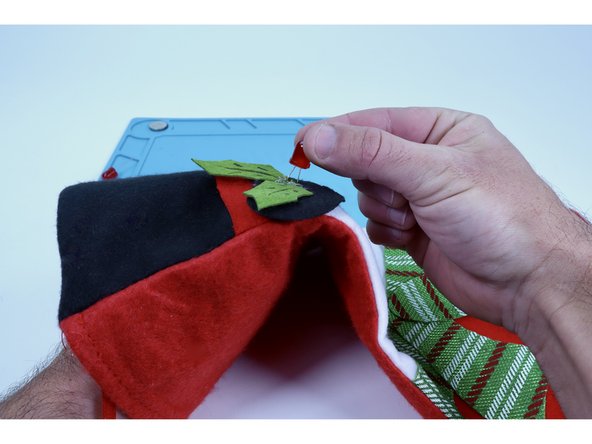 Thread your LED legs through those pilot holes from the front all the way to the inside of the stocking. 