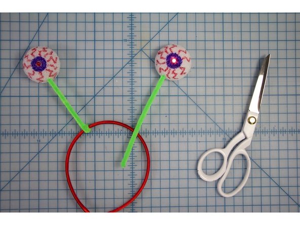 Twist the other ends of the pipe cleaners around the headband.