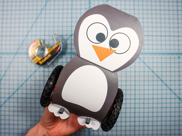 Fold the wings along the dotted line.