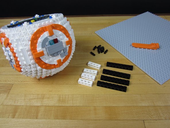 Using 1x4 and 1x8 Technic bricks, construct an adaptor to mount the BB-8 onto your large Base Plate.