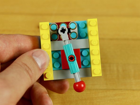 You'll need to put the Vertical Pin on top of a LEGO plate to get spacing correct with the Switch.