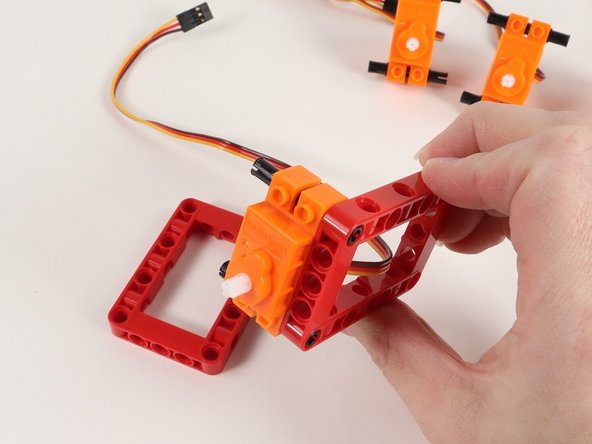 Add red frames onto each side of the servo.