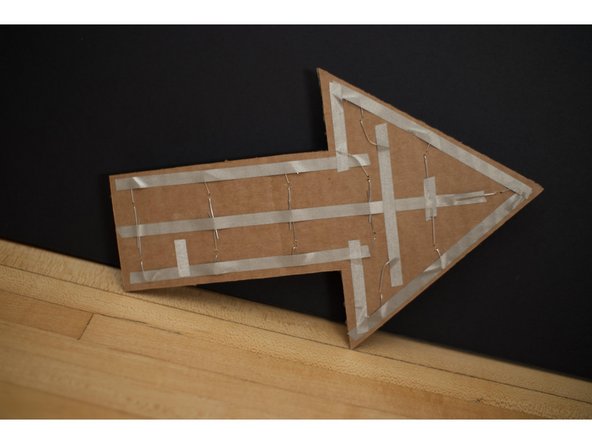 Connect all positive legs together with tape down the center of the arrow.