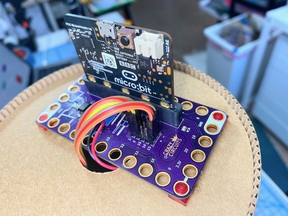 We connected the battery pack to the screw terminal and placed it through the hole to rest inside the center tube.