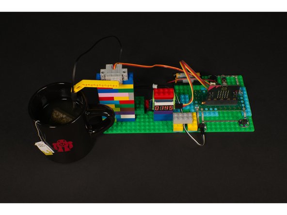 If you don't want to use a 7 Segment Display you could use a few LEDs to indicate temperature. Or if you want to make it more complex you could add an OLED Display.