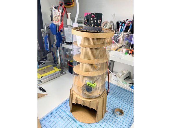 We cut a piece of plastic to wrap around the track and secured it in the back with clear packing tape.