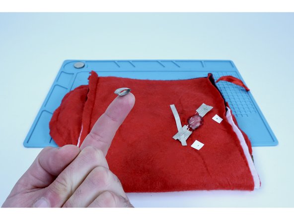 Cut a smaller piece of Maker Tape and make a tape loop out of it.