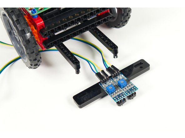 Attach the Line Following Bar to the pins we added to the beams.