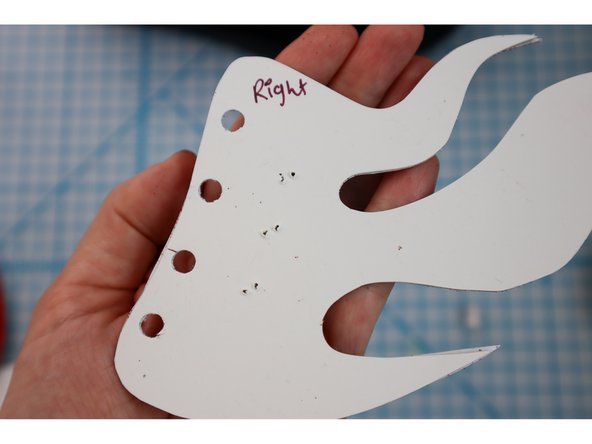 Use a hole punch to punch them out.