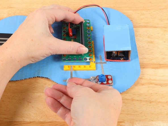 Replace the potentiometer to help secure the tape path in place.