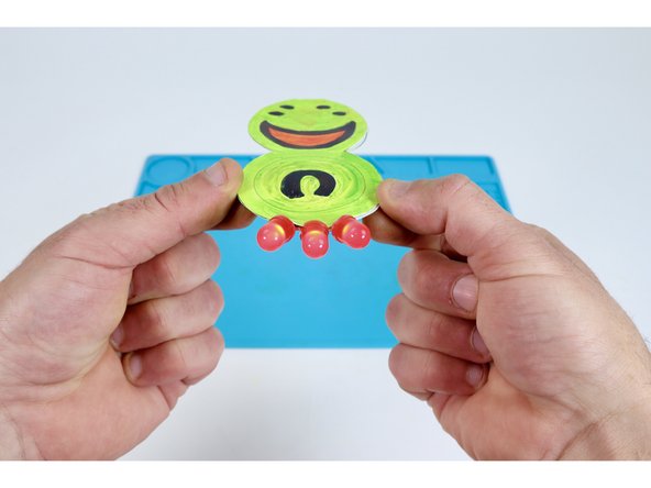 Press your colored top atop this glue bead so it lines up with the bottom shape and hides the battery.