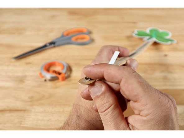 Measure, cut and peel a small piece of Maker Tape approximately 1" long. Then roll it into a small "sticky-side-out" tape loop.