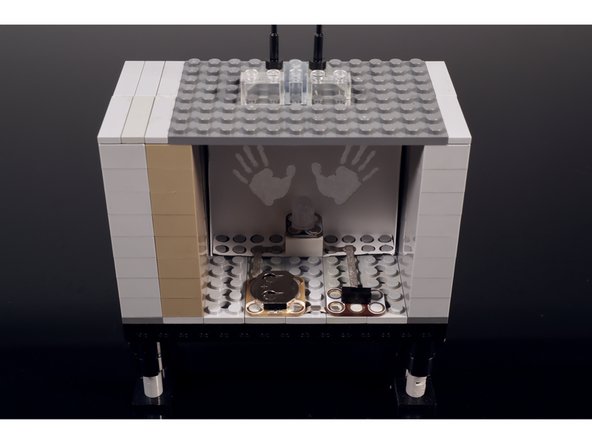 Build the two side walls of the TV and add a top and an antenna. You can always use the same parts that are shown but you can also improvise a different build if you don't have these same LEGOS.