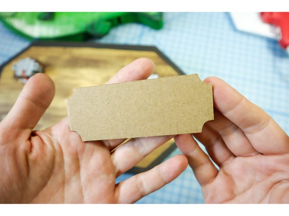 Cut a small nameplate from cardboard and name your fish!