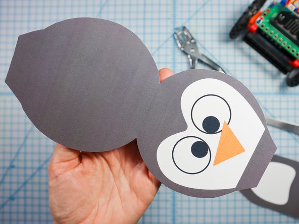 Fold along the dotted lines as shown.