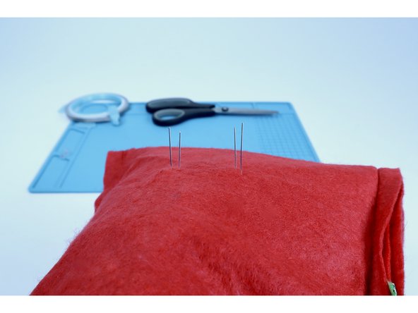 Thread your LED legs through those pilot holes from the front all the way to the inside of the stocking. If you oriented the LED legs correctly they should look like photo 2. The outer legs should be longer while the inner legs should be shorter. If you got that wrong, simply pull the component(s) out, flip the leg orientation and reinsert.