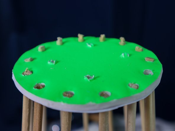 Cut the dowles off above the circle as shown.