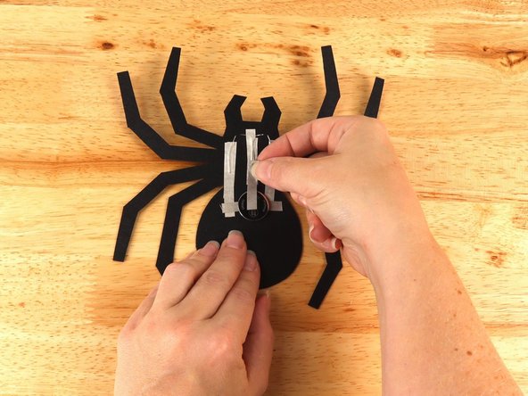 Add Maker Tape to connect the top (Positive) side of the battery to the Positive LED legs path above.