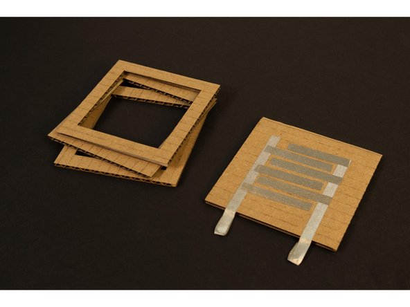 Attach Pieces 2, 3, and 4 to Piece 1 by stacking and gluing them together. (You can also use tape instead of glue if desired.)